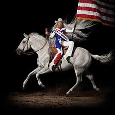 Cover art for Beyonce's Cowboy Carter album, featuring Beyonce on a running white horse, with a platinum blonde wig and cowboy hat, holding an American flag.
