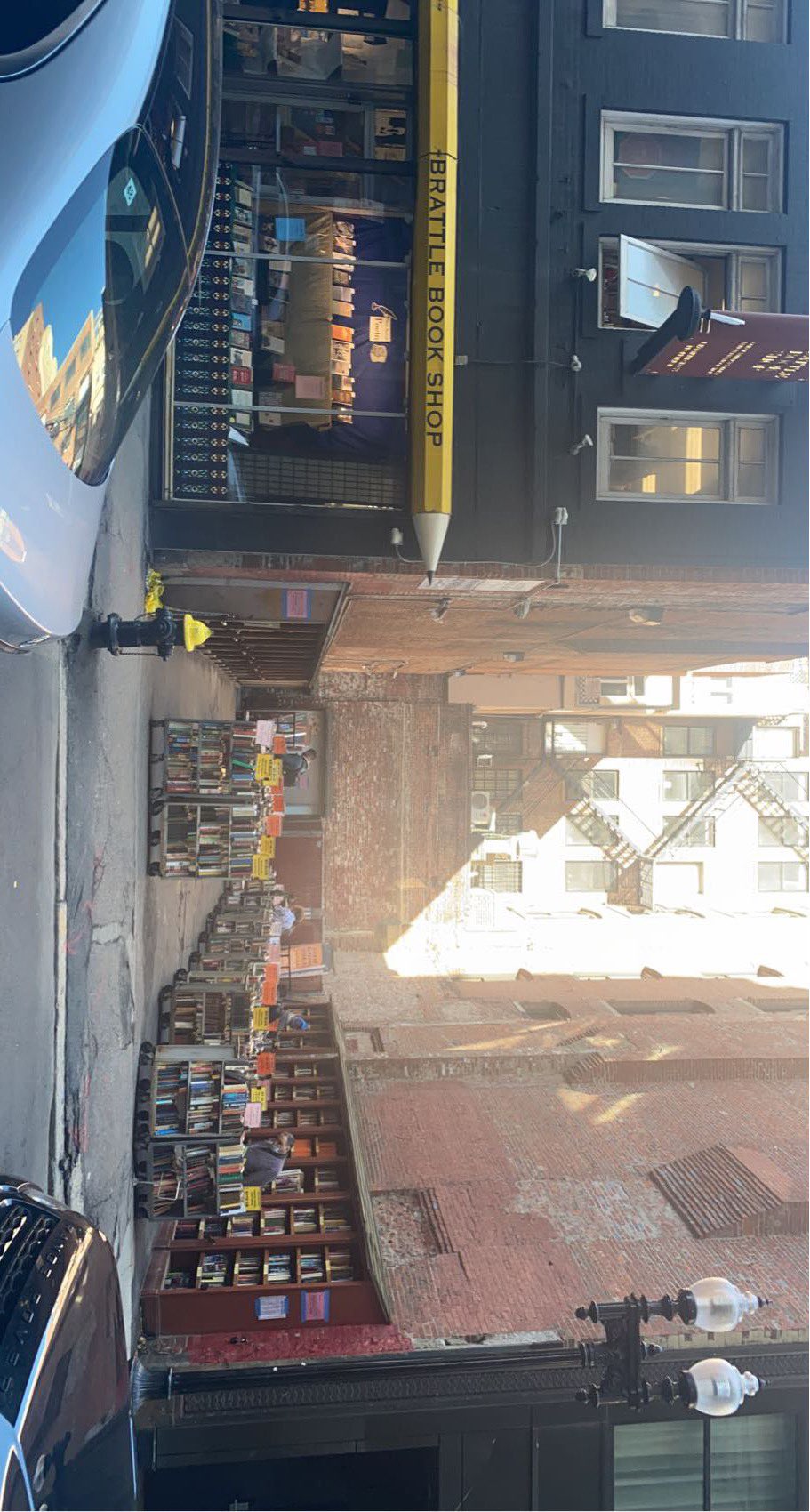 The storefront of Brattle Book Shop and its outdoor space.