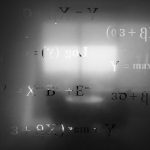 Image of frosted glass with math equations. Photo courtesy of Saad Ahmad