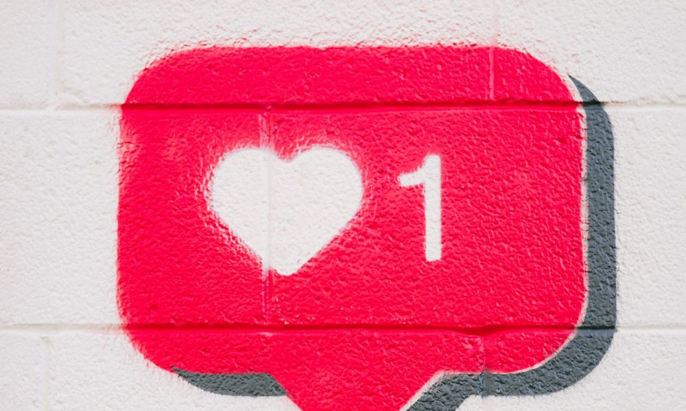 A spray painted like icon with one heart