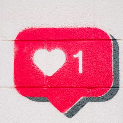 A spray painted like icon with one heart