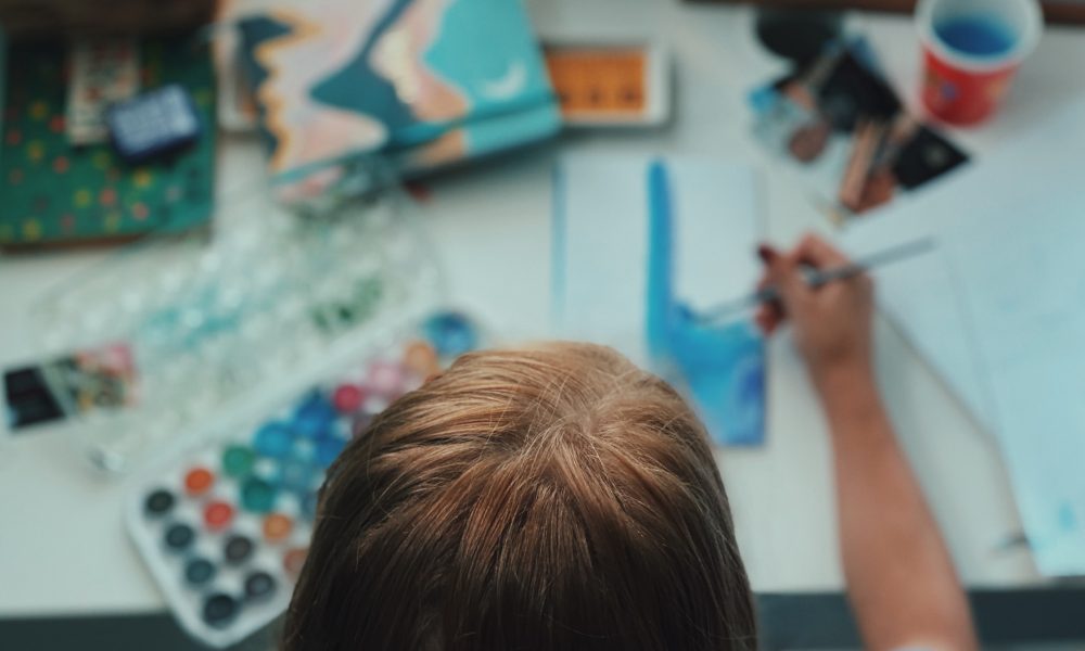 a young child painting