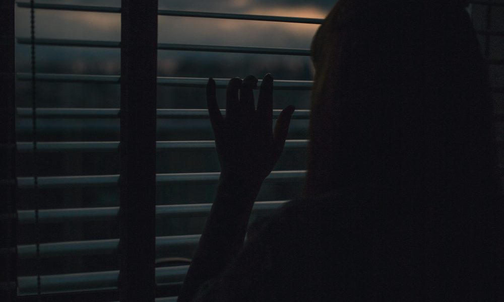 Women looks out a window