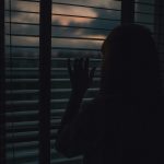 Women looks out a window