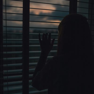 Women looks out a window