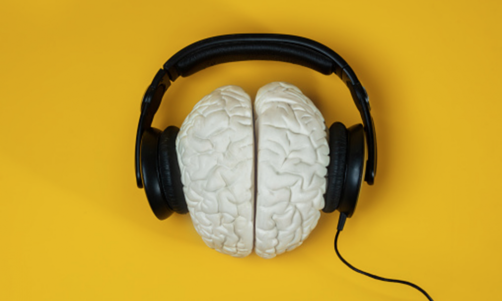 Image of brain wearing headphones- Image courtesy of SerrNovik on Unsplash