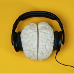 Image of brain wearing headphones- Image courtesy of SerrNovik on Unsplash