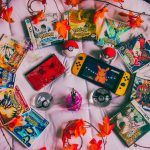 Photo of Pokemon cards and a nintendo switch. Photo courtesy of Branden Skeli on Unsplash.