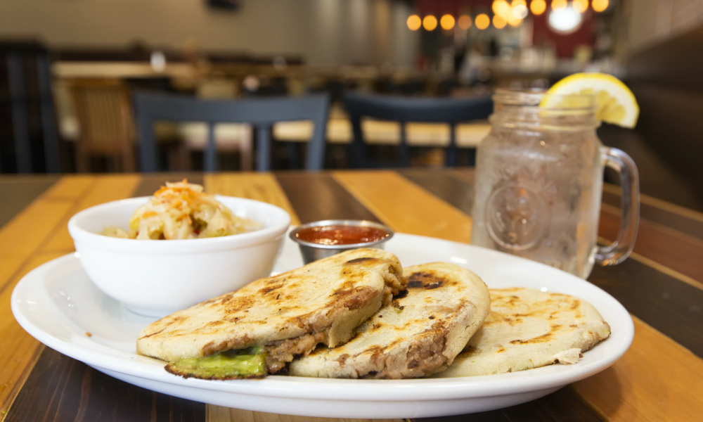 Image of pupusa and drinks around table- Image courtesy of Daniel Lloyd Blunk-Fernández on Unsplash