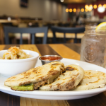 Image of pupusa and drinks around table- Image courtesy of Daniel Lloyd Blunk-Fernández on Unsplash