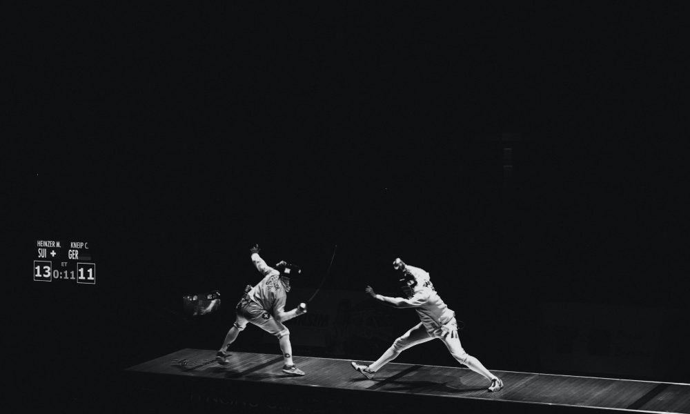 Image of two people fencing-Image courtesy of Micaela Parente on Unsplash