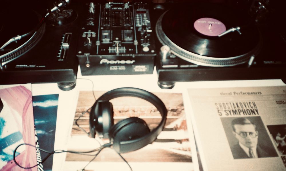 Image of headphones and record player on desk- Image courtesy of Inga Seliverstova on Unsplash