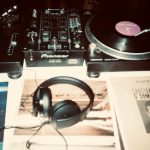 Image of headphones and record player on desk- Image courtesy of Inga Seliverstova on Unsplash