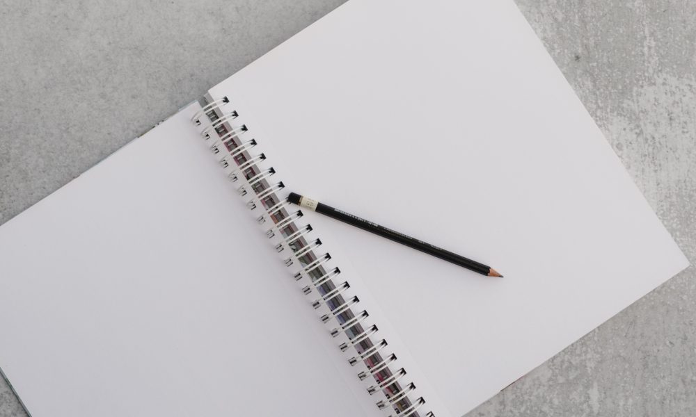Photo of a notepad and pencil