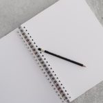 Photo of a notepad and pencil