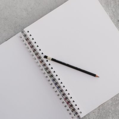 Photo of a notepad and pencil