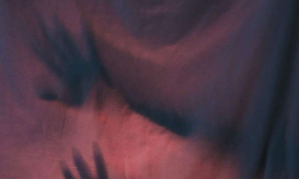 image of hands behind curtain scary