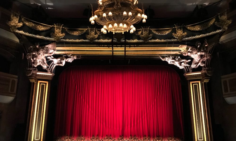 Photo of theater with the curtains closed.