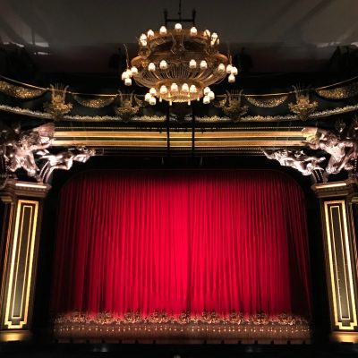 Photo of theater with the curtains closed.