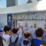 Youth pinning Boston Strong stickers