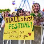 Photo of fans in front of stage Niall Horan