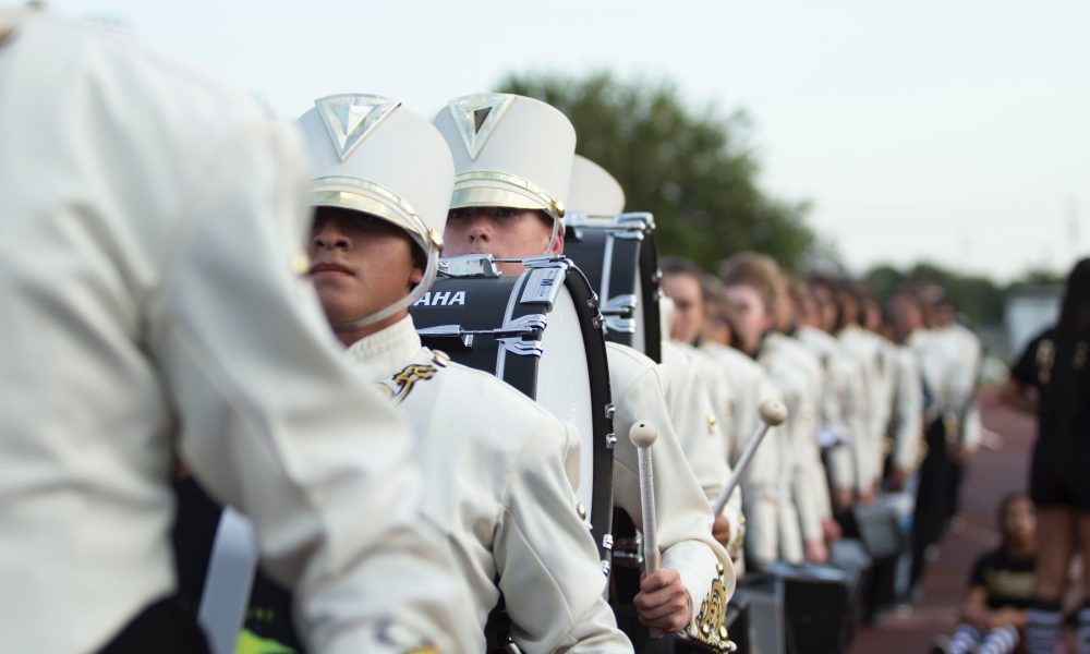 Photo of a marching band. Photo courtesy of Katrina Berban on Unsplash.