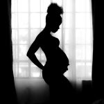 photo of pregnant women in black silhouette