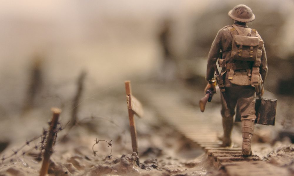 Photo of solider walking. Photo courtesy of Stijn Swinnen on Unsplash.