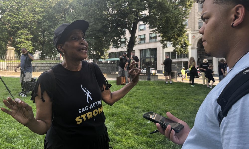 Albin Casilla talking to SAG-AFTRA New England President in the Boston Common. Photo courtesy of TiP Staff.