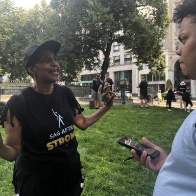 Albin Casilla talking to SAG-AFTRA New England President in the Boston Common. Photo courtesy of TiP Staff.