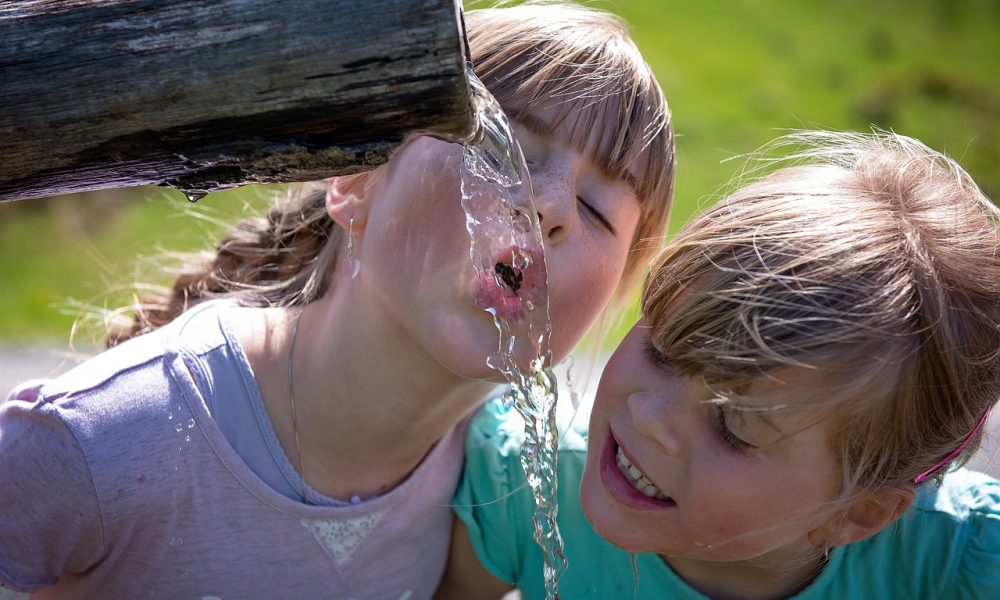 Image of children drinking water from fountain
