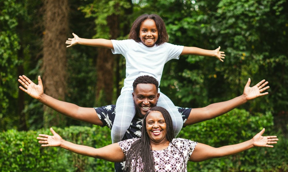 Photo of a family posing. Photo courtesy of sarugue Igbinoba on Unsplash.
