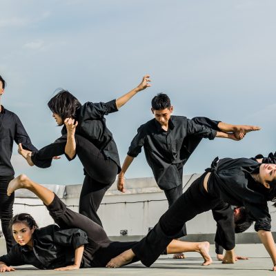 Image of dancers posing in all black