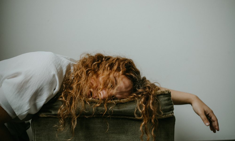 Photo of a person sleeping. Photo courteys of Sinitta Leunen on Unsplash.