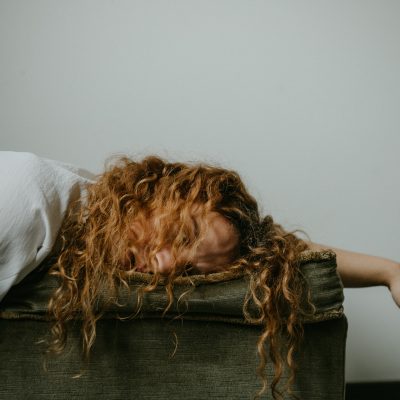 Photo of a person sleeping. Photo courteys of Sinitta Leunen on Unsplash.