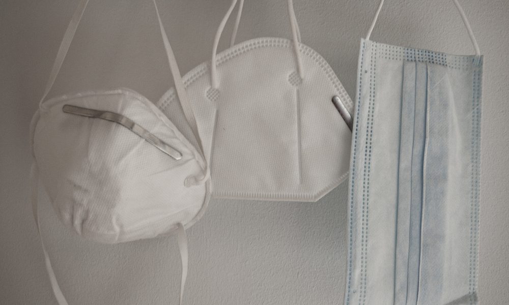 Photo of Covid masks. Photo courtesy of Isaac Quesada on Unsplash.