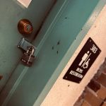 Photo of the boys bathroom at Boston Latin Academy with a lock on it. Photo courtesy of the author.