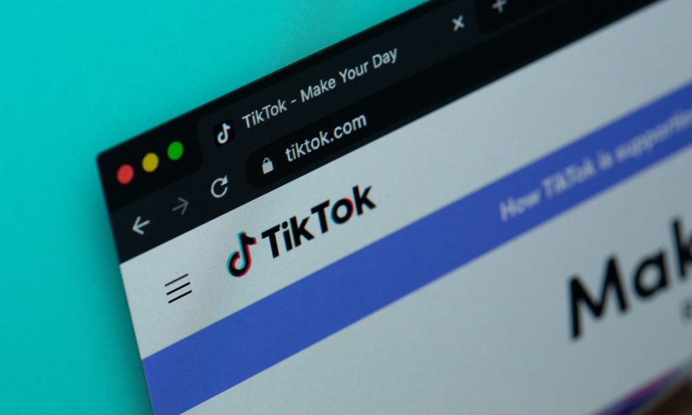 A computer screen with the word tiktok on it. Photo courtesy of Solen Feyissa on Unsplash.
