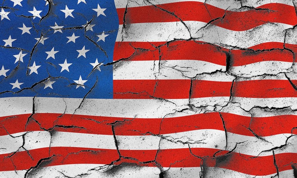 Photo of a cracking American flag. Courtesy of pexels.