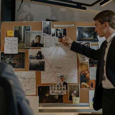 Photo by cottonbro studio: https://www.pexels.com/photo/detectives-looking-at-evidences-on-cork-board-8369522/