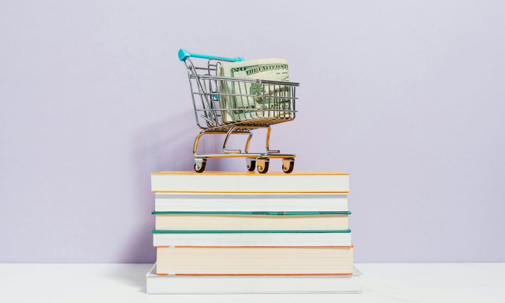 Photo by Karolina Kaboompics on Pexels. Shopping-cart-on-top-of-books