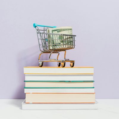 Photo by Karolina Kaboompics on Pexels. Shopping-cart-on-top-of-books