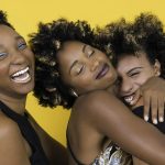 Women Wearing Party Dresses Hugging Each Other. Photo courtesy of Nappy on Pexels.