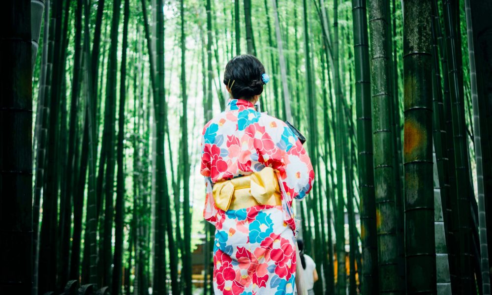 Woman wearing a kimono in the forest. Photo courtesy of Lan Pham on Unsplash.