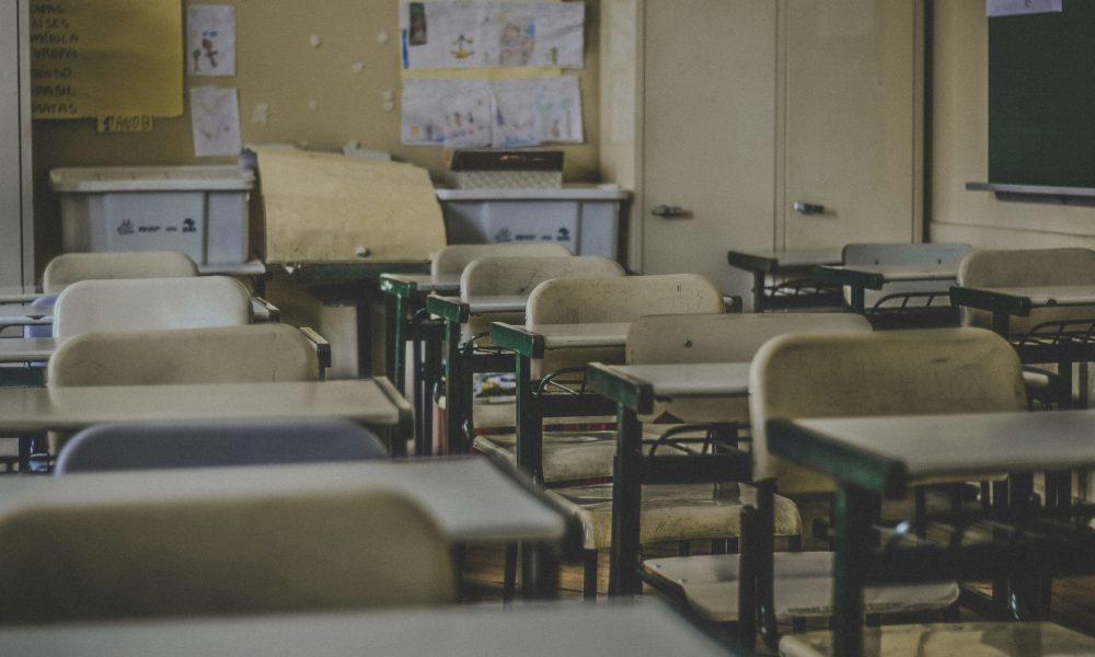 Photo of empty classroom courtesy of Feliphe Schiarolli on Unsplash.