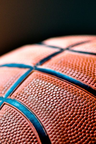 Photo of basketball courtesy of Kylie Osullivan on Unsplash.