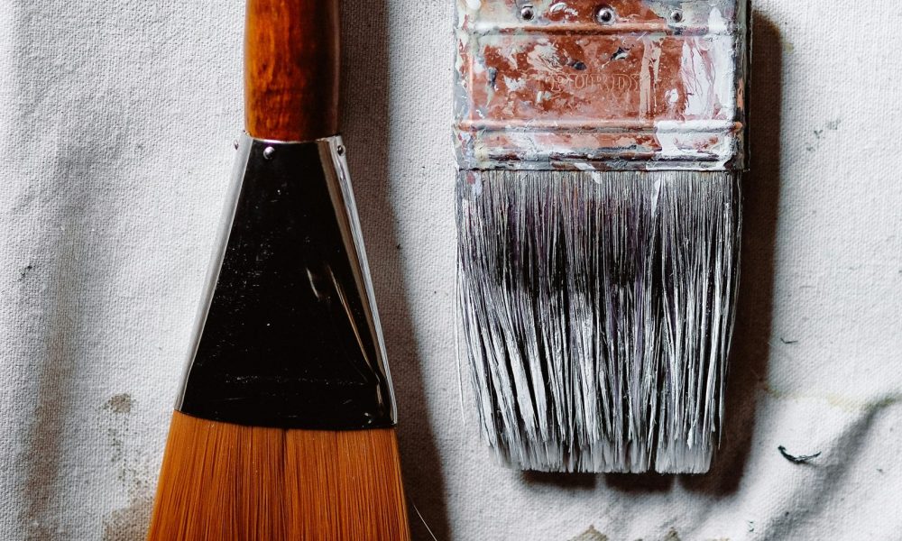 Photo of paint brushes courtesy of Wesley Tingey on Unsplash.