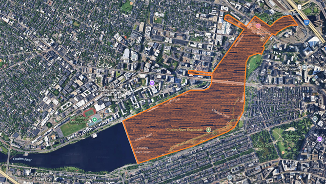 Arial photo of the Charles River, with spread of bacteria colored in orange.