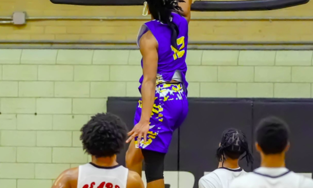 Caleb Florence dunking a basketball.