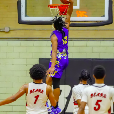 Caleb Florence dunking a basketball.